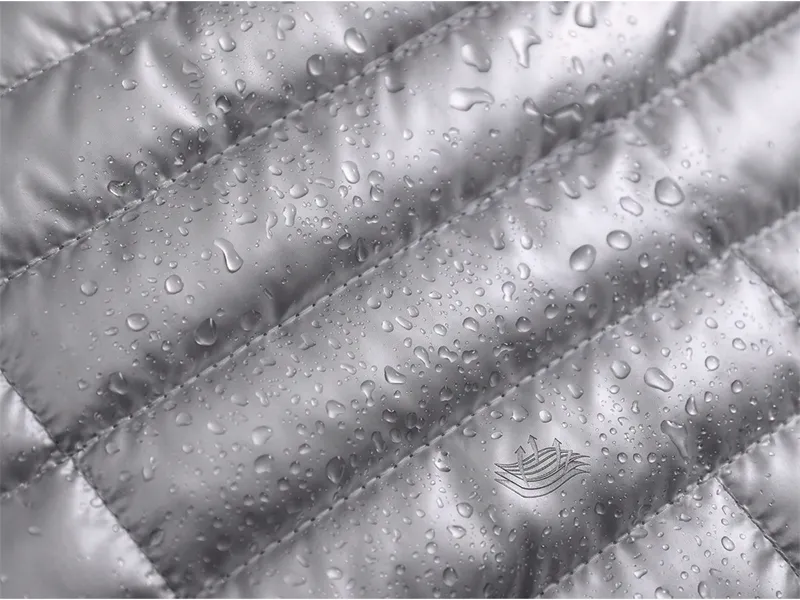 Close-up of water-resistant cationic fabric and heavy-duty hardware for travel bags